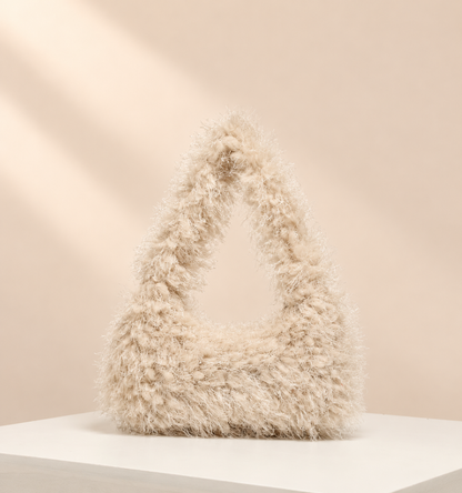 Velmora Fluffy Hobo Bag — warm beige studio background