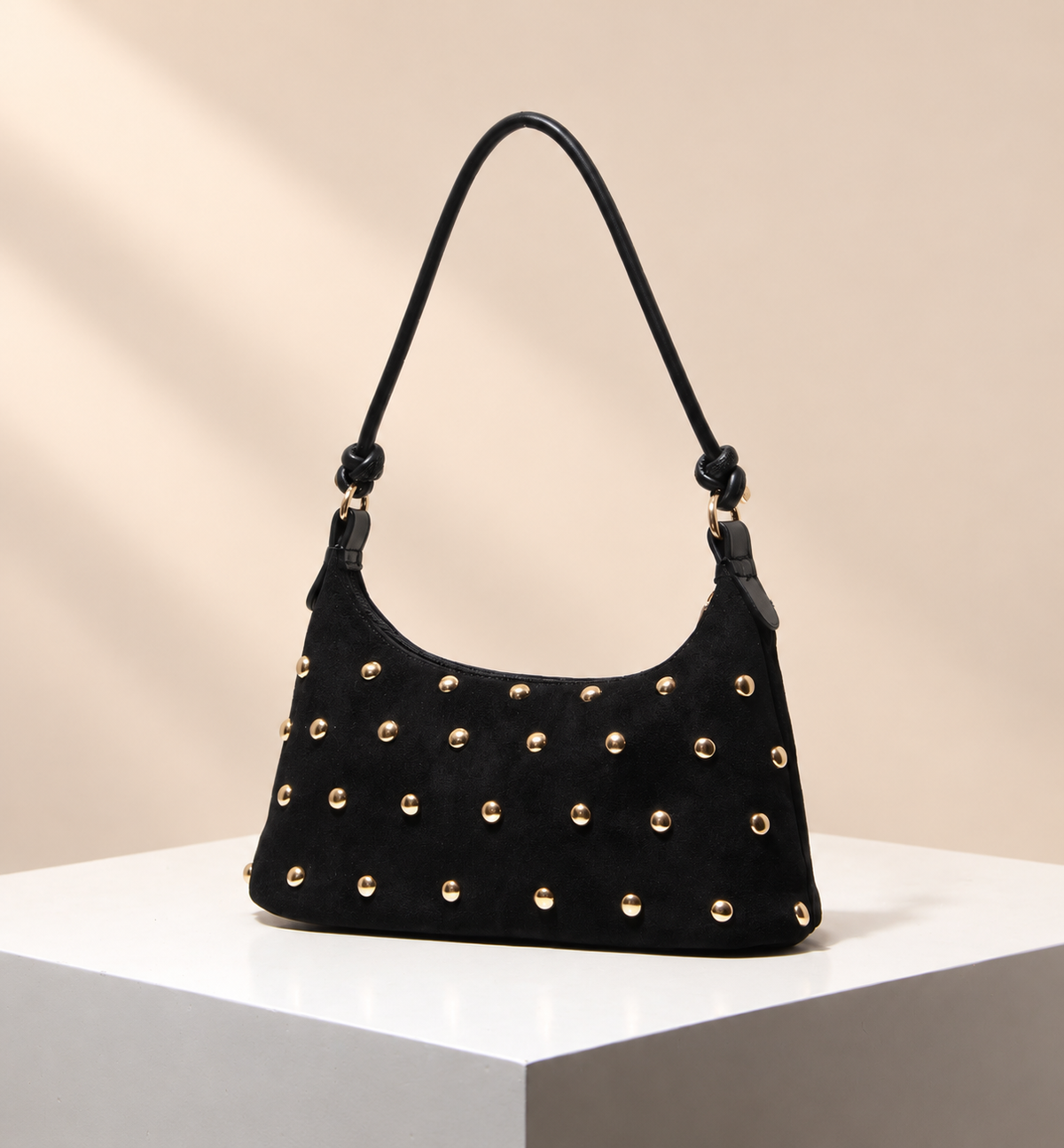 Elvaris Stud Detail Shoulder Bag — warm beige studio background