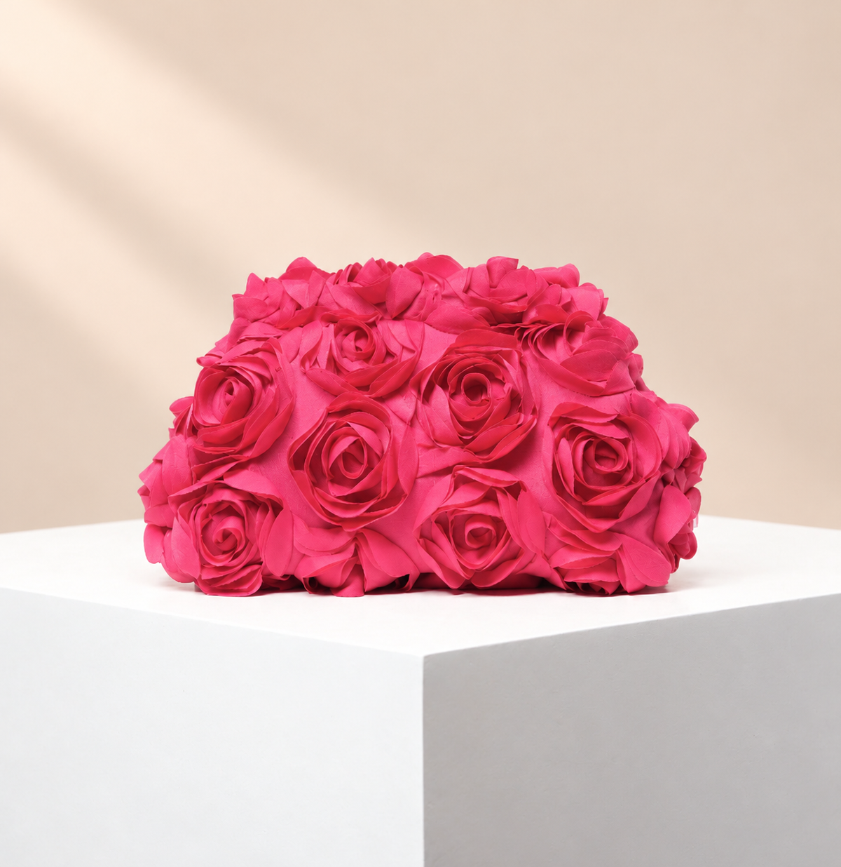 Rosavelle Rosette Occasion Clutch — warm beige studio background