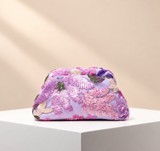 Aurevia Floral Occasion Clutch — warm beige studio background