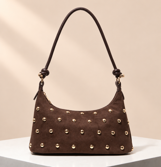 Varelle Studded Shoulder Bag — warm beige studio background