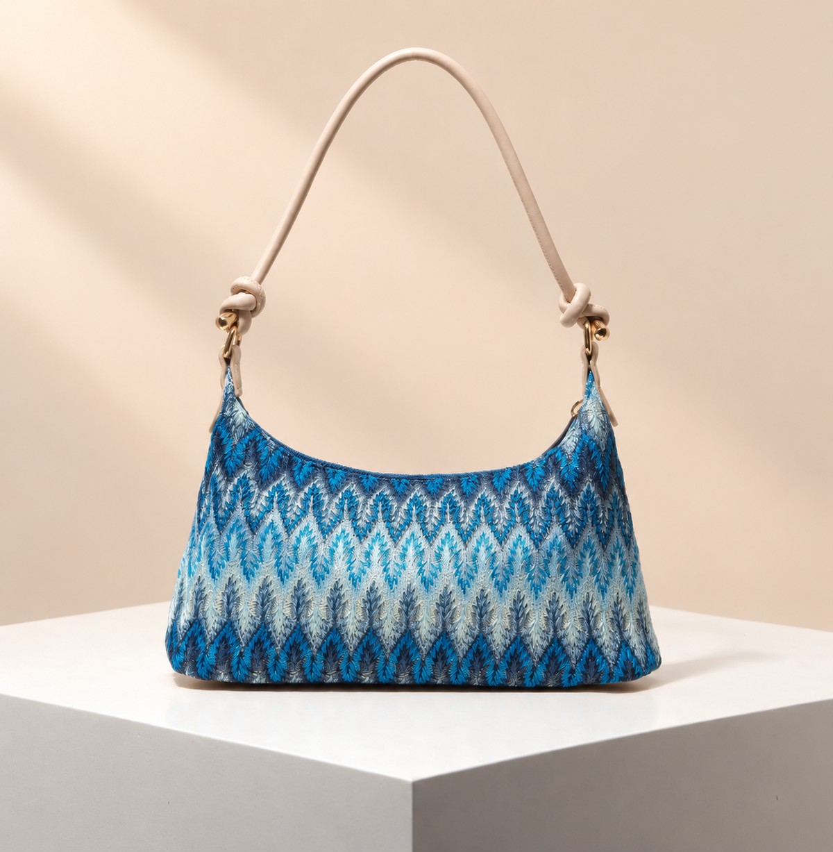 Orlienne Patterned Shoulder Bag — warm beige studio background
