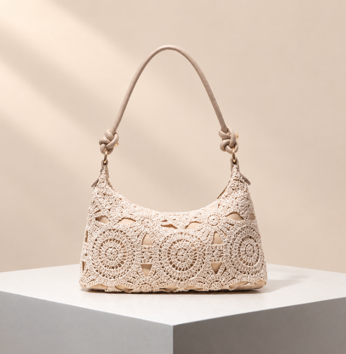 Avelisse Crochet-Effect Shoulder Bag — warm beige studio background