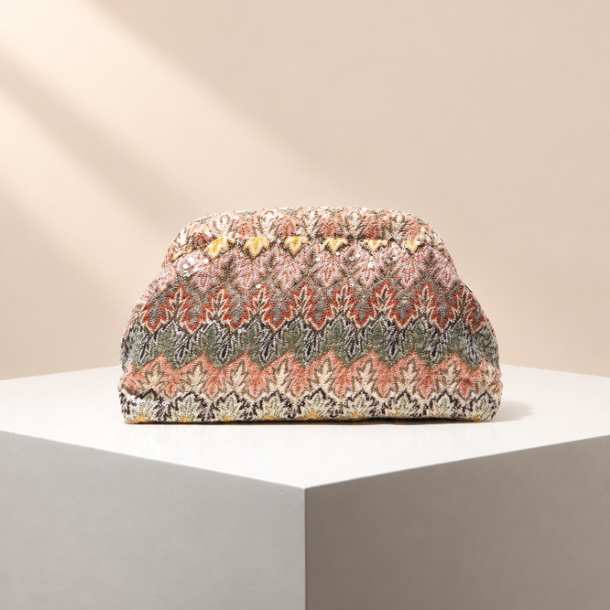 Fioravelle Patterned Occasion Clutch — warm beige studio background
