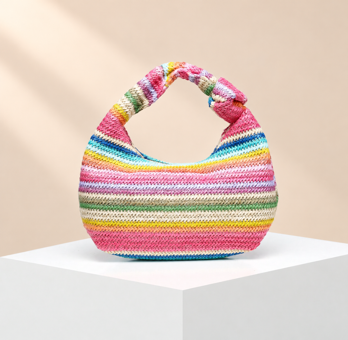 Calienne Striped Knit-Effect Hobo Bag — warm beige studio background