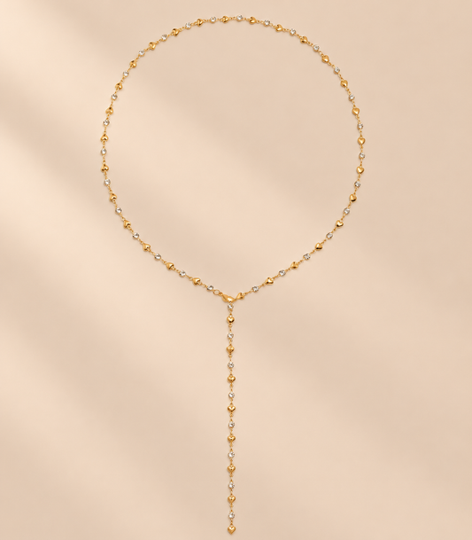 Amorielle Rhinestone Heart Necklace — warm beige studio background
