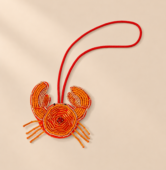 Hibiselle Beaded Bag Charm — warm beige studio background