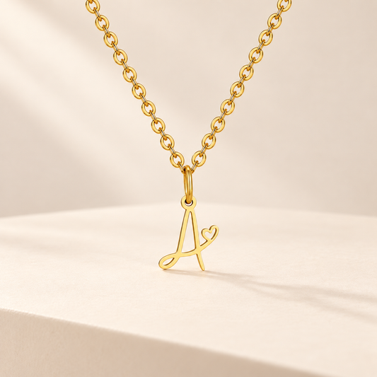 AmélieHeart A–Z Initial Pendant Necklace — ivory studio product photograph