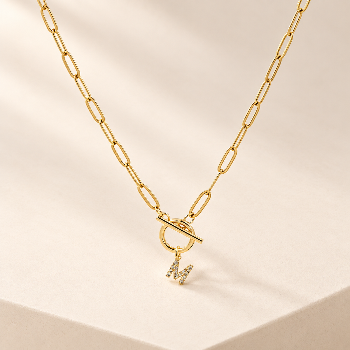 ElaraInitial Paperclip Chain Necklace — ivory studio product photograph