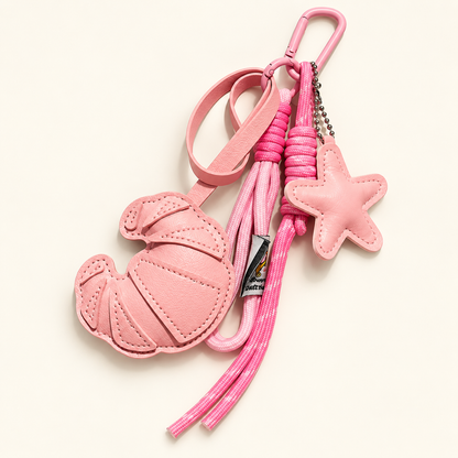 CocoaStar Croissant Leather Bag Charm — Pink — ivory studio photograph