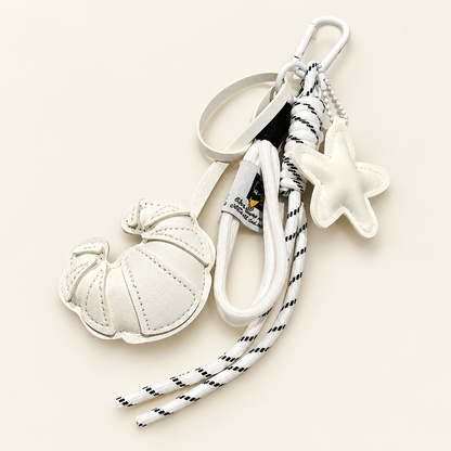 CocoaStar Croissant Leather Bag Charm — White — ivory studio photograph
