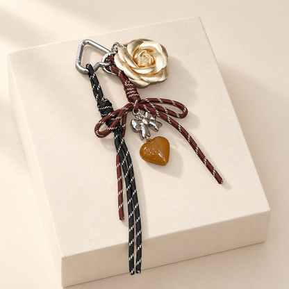 CaméliaHeart Camellia Flower Bag Charm — ivory studio product photograph