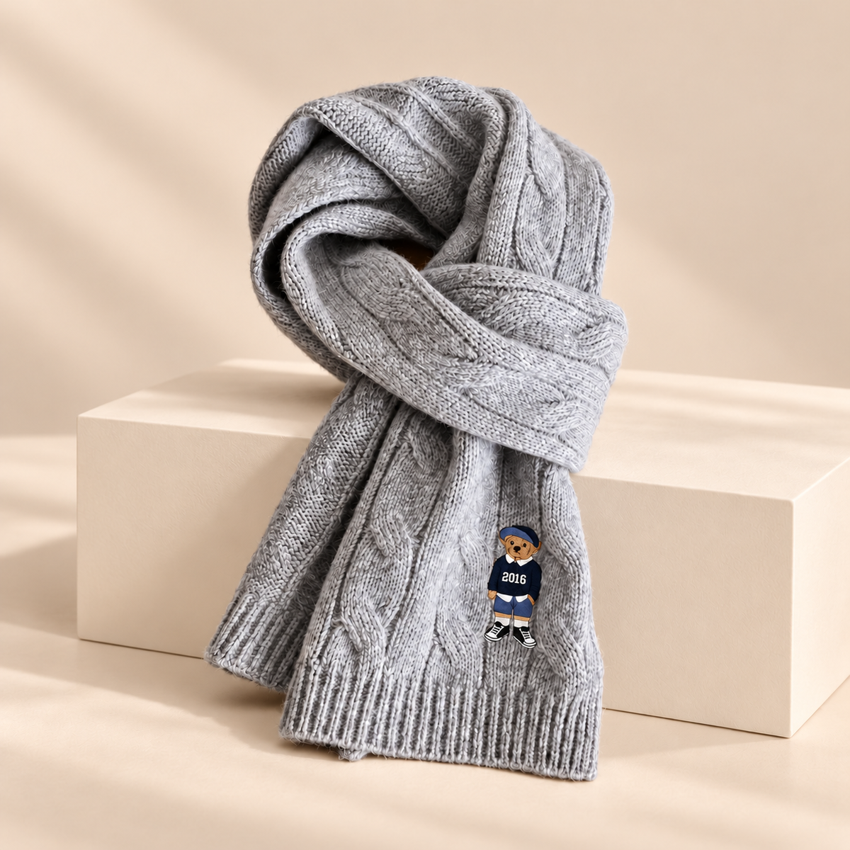 Bramwell Australian Wool Cable Knit Scarf — warm beige studio background