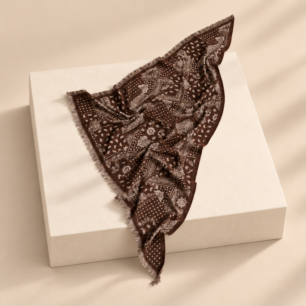 Aveline Jacquard-Style Triangle Scarf — warm beige studio background