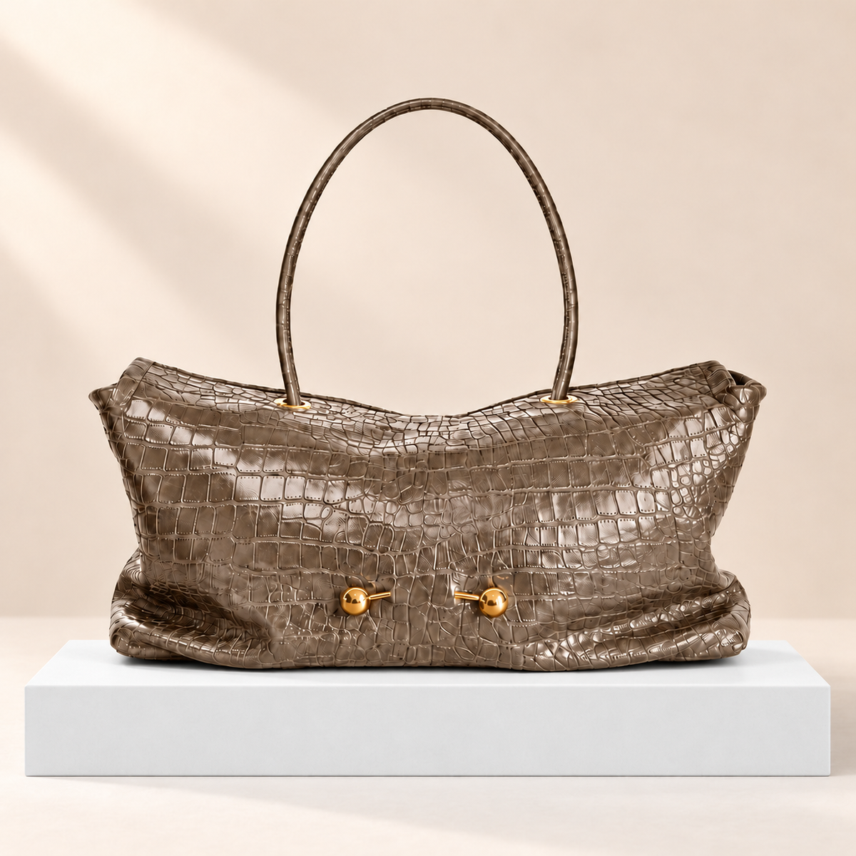 Corvessa Croc-Embossed Slouchy Tote Bag — white plinth, warm beige background