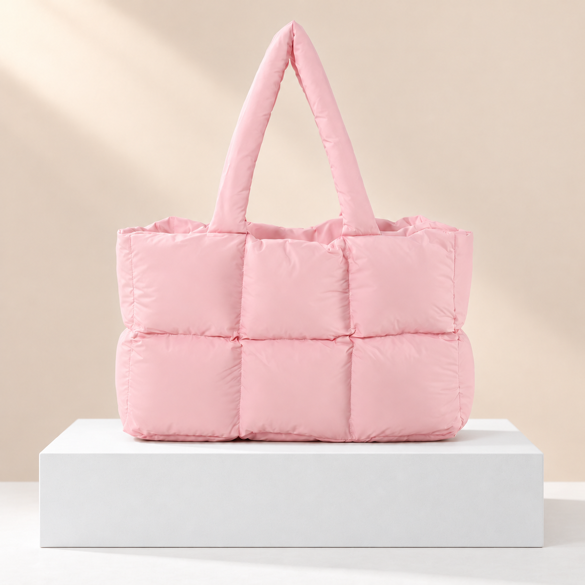 Tessavie Quilted Checkered Tote Bag — white plinth, warm beige background