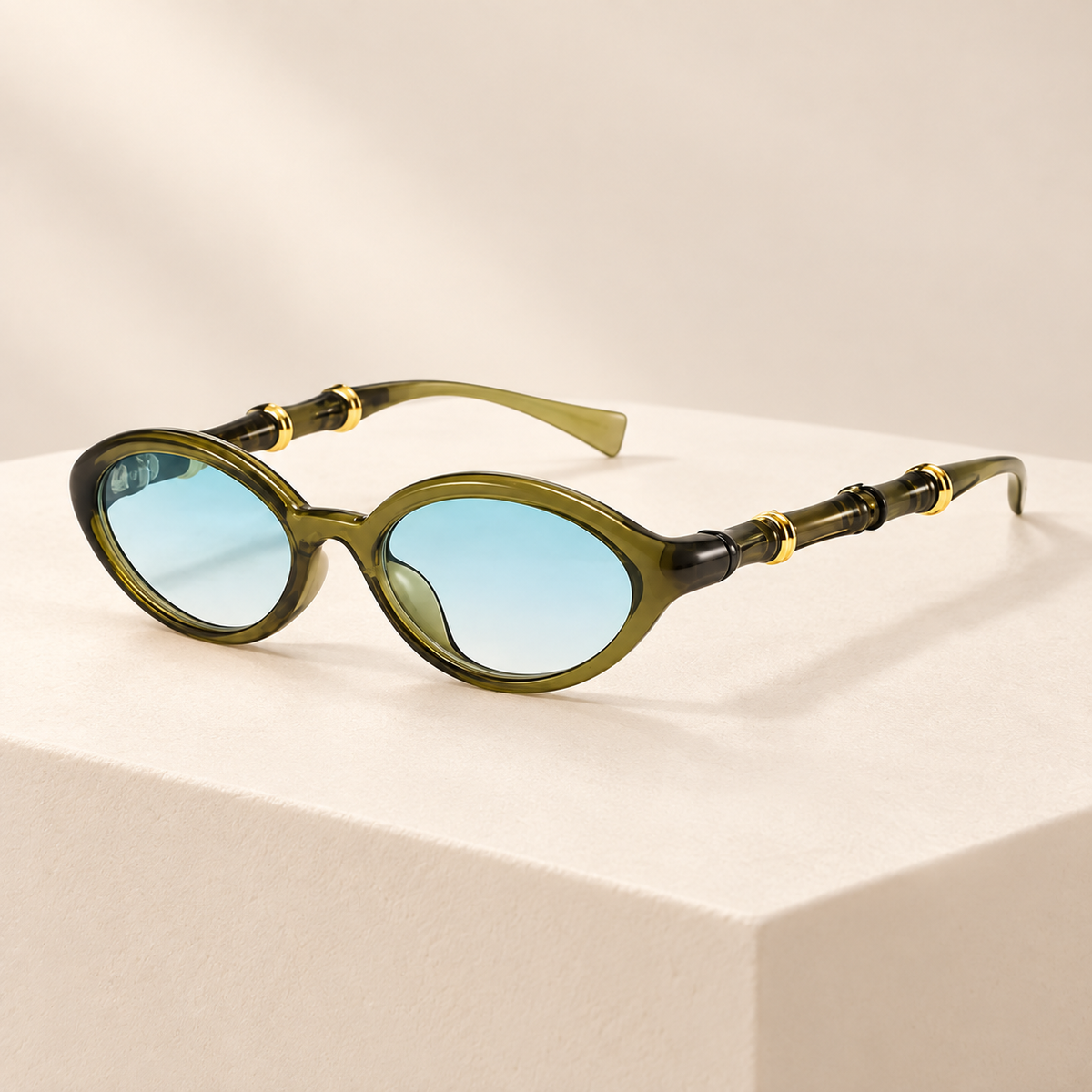 Rivelle Retro Rivet Oval Sunglasses — ivory studio product photograph