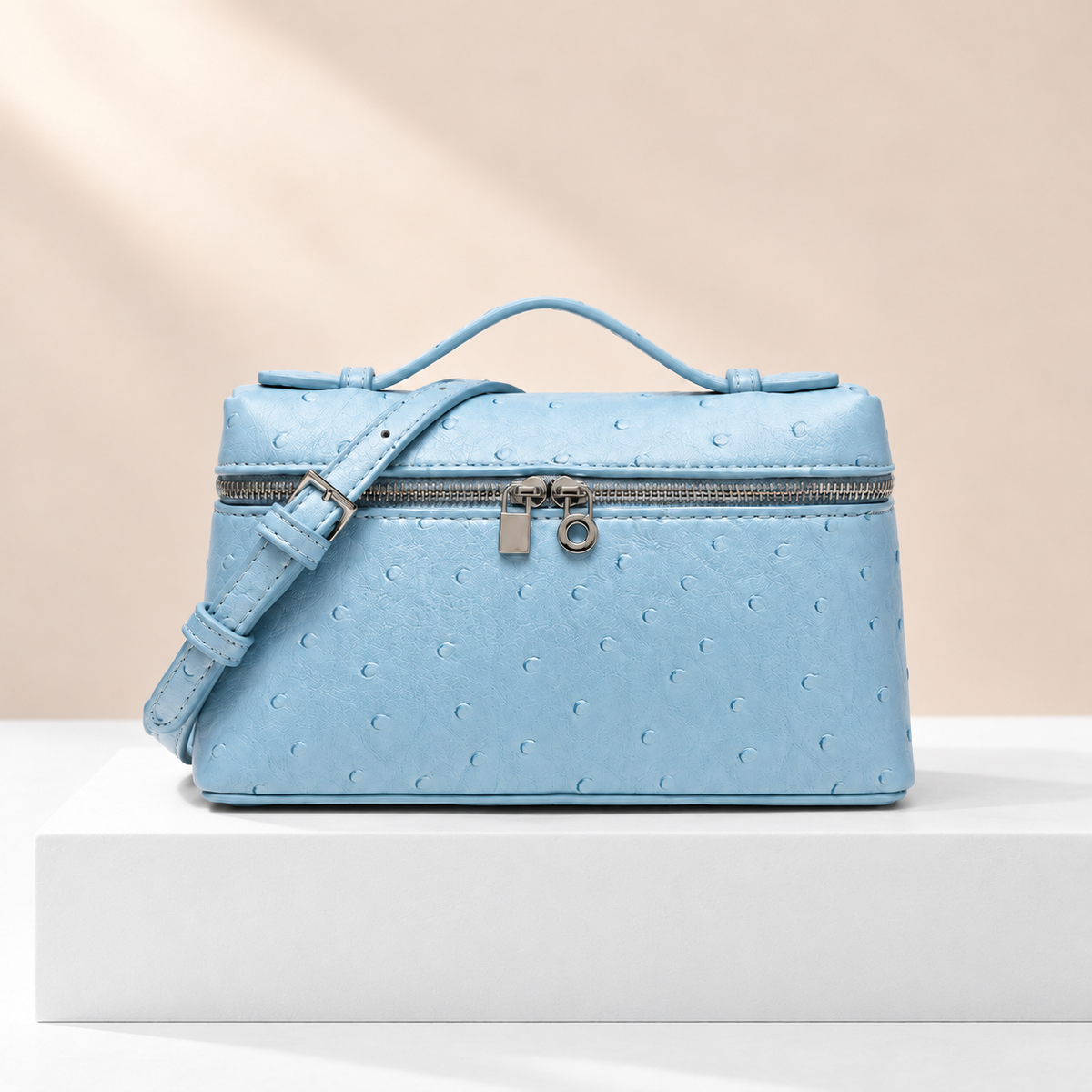 Elowen Textured Mini Box Bag — white plinth, warm beige background