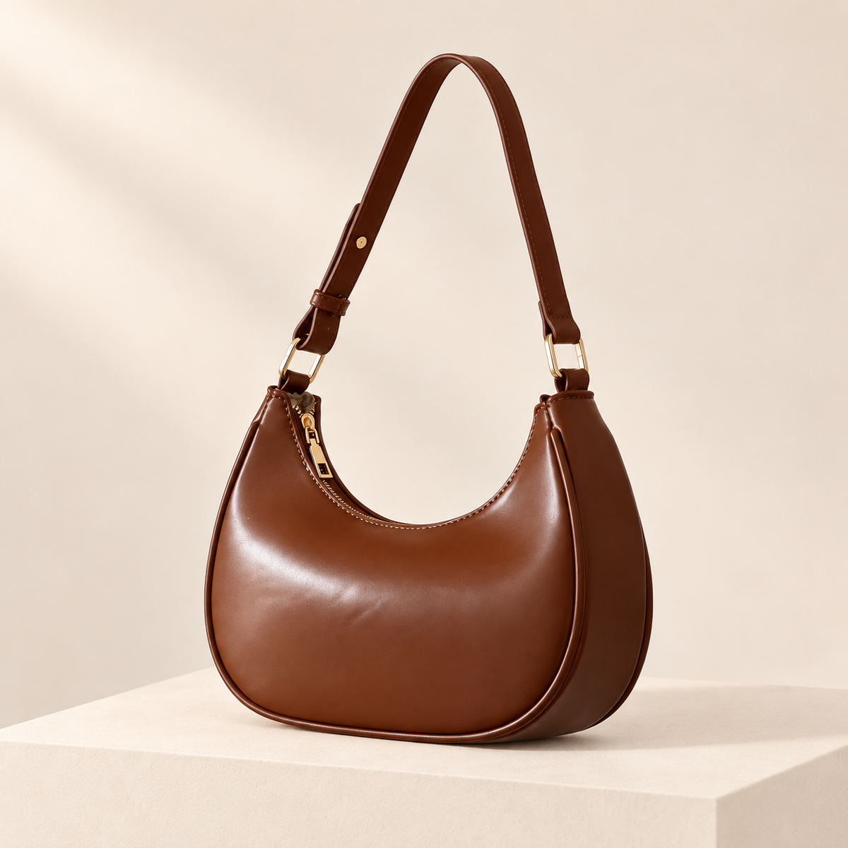Mirevane Crescent Shoulder Bag — Coffee — ivory studio product photograph