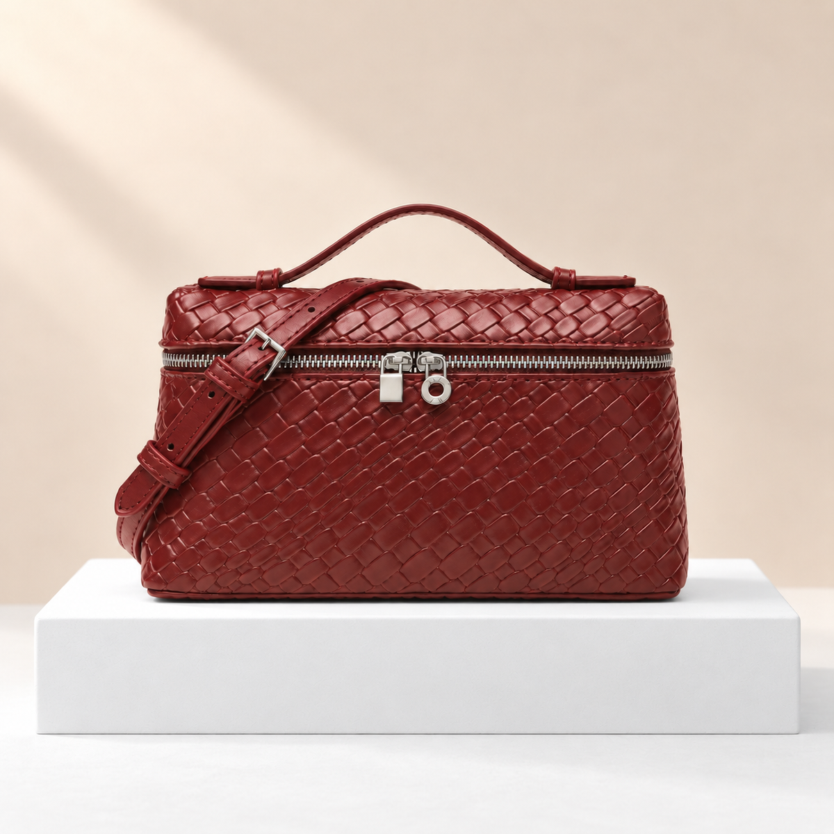 Velmora Geometric Pattern Bag — white plinth, warm beige background