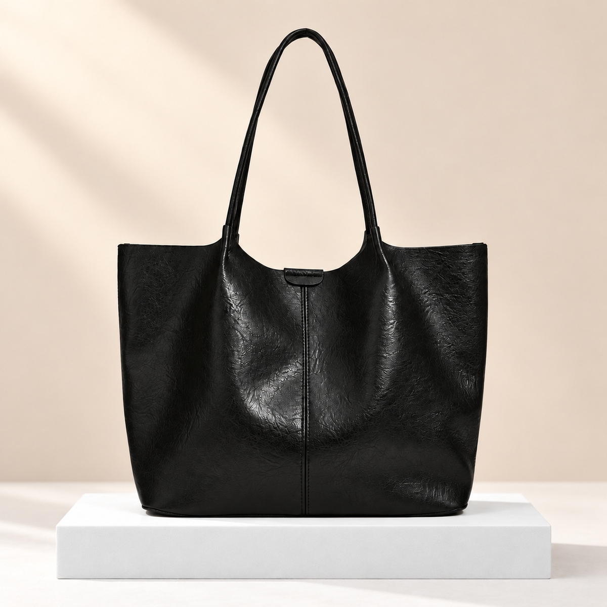 Verdelis Classic Shoulder Tote — white plinth, warm beige background