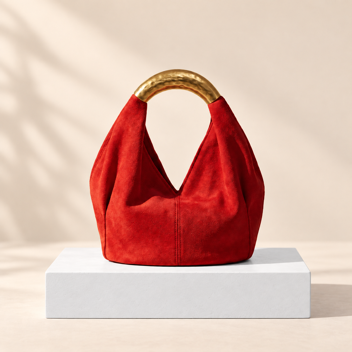Avelisse Metal Handle Mini Bag — white plinth, warm beige background