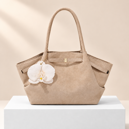 Mirevane Flower Detail Shoulder Tote — white plinth, warm beige background