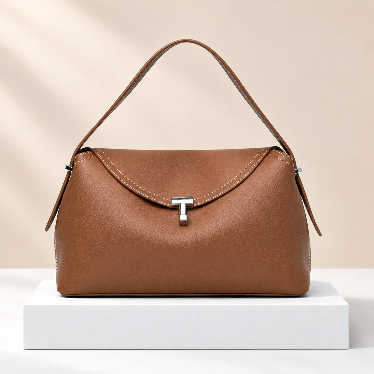 Bravelle Flap Shoulder Bag — white plinth, warm beige background