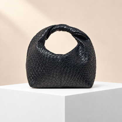 Velmora Woven-Effect Top Handle Bag — white plinth, warm beige background