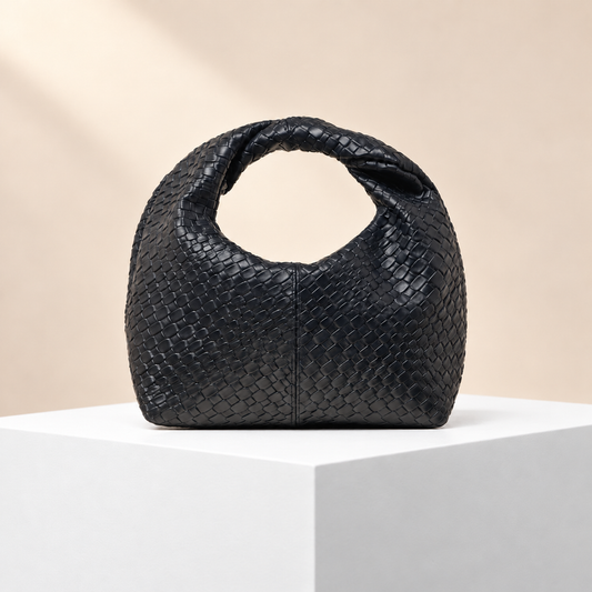 Velmora Woven-Effect Top Handle Bag — white plinth, warm beige background
