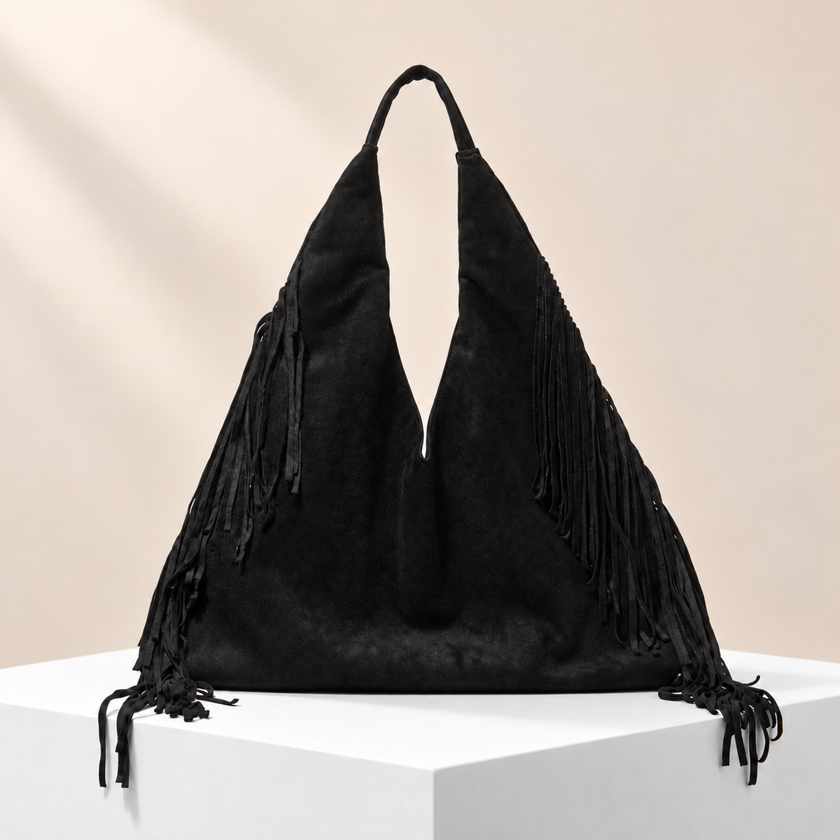 Aurevine Fringe Shoulder Tote — white plinth, warm beige background