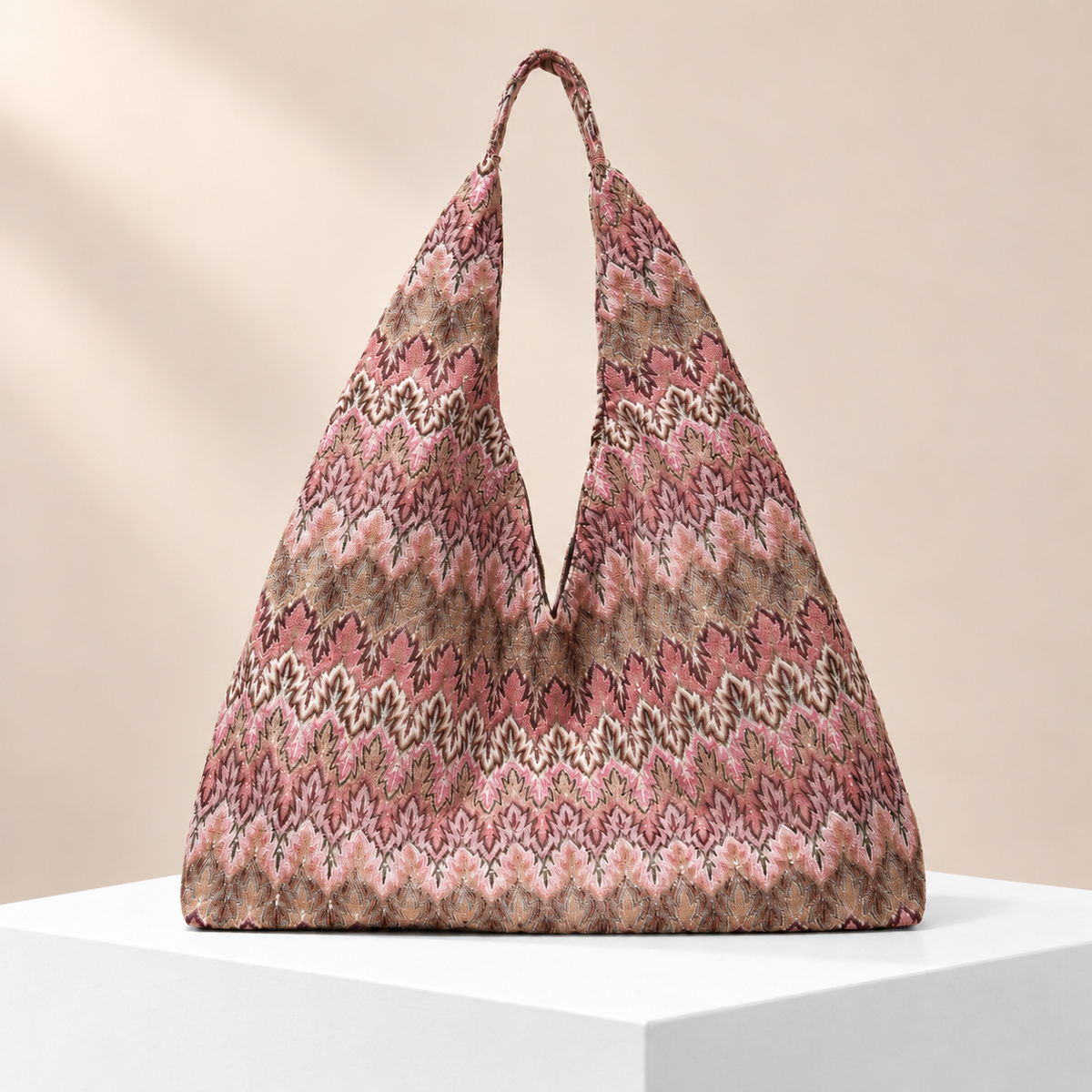 Mirevane Patterned Shoulder Tote — white plinth, warm beige background