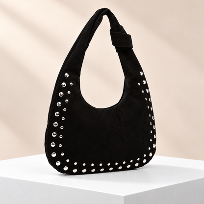 Rivelle Studded Hobo Bag — white plinth, warm beige background