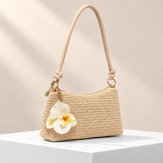 Solmira Orchid Shoulder Bag — white plinth, warm beige background