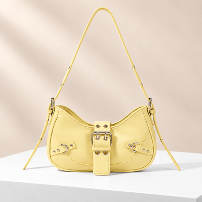 Buckelle Buckle Shoulder Bag — white plinth, warm beige background