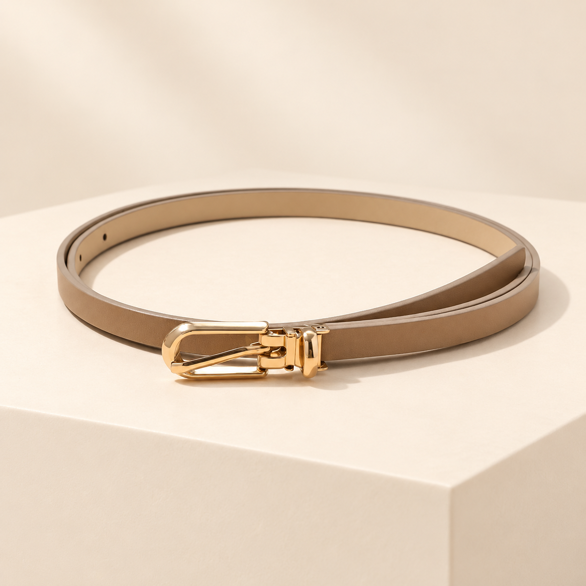 Elowra Sculpted Buckle Skinny Belt — ivory studio gallery photograph