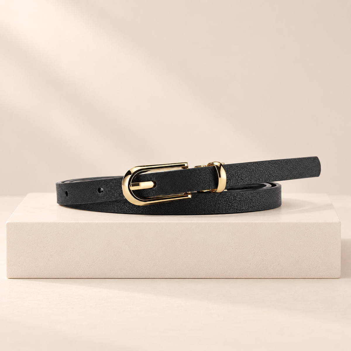 Elowra Sculpted Buckle Skinny Belt — studio product photograph