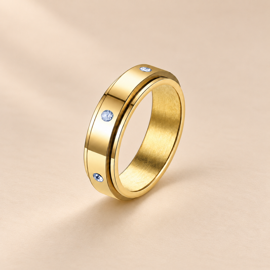 Tranquility Spinner Ring — warm beige studio background