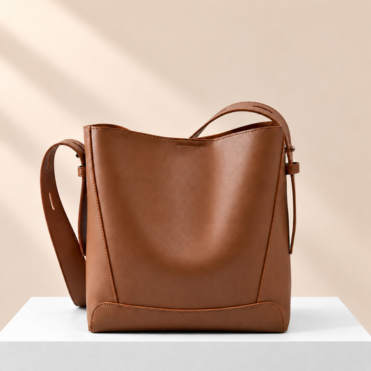 The Olivia Bag — white plinth, warm beige background