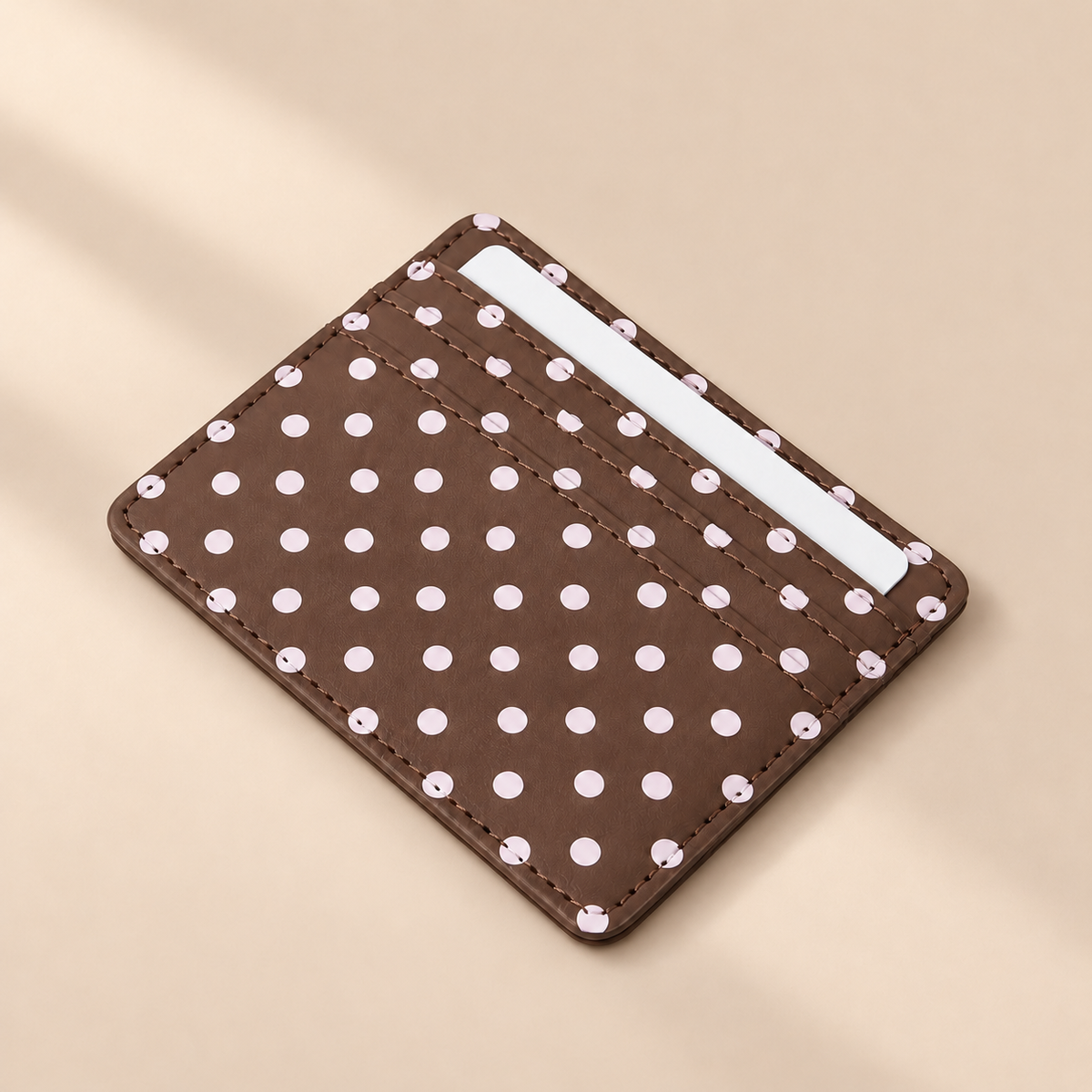 Dottie Coffee Polka Dot Card Holder — warm beige studio background
