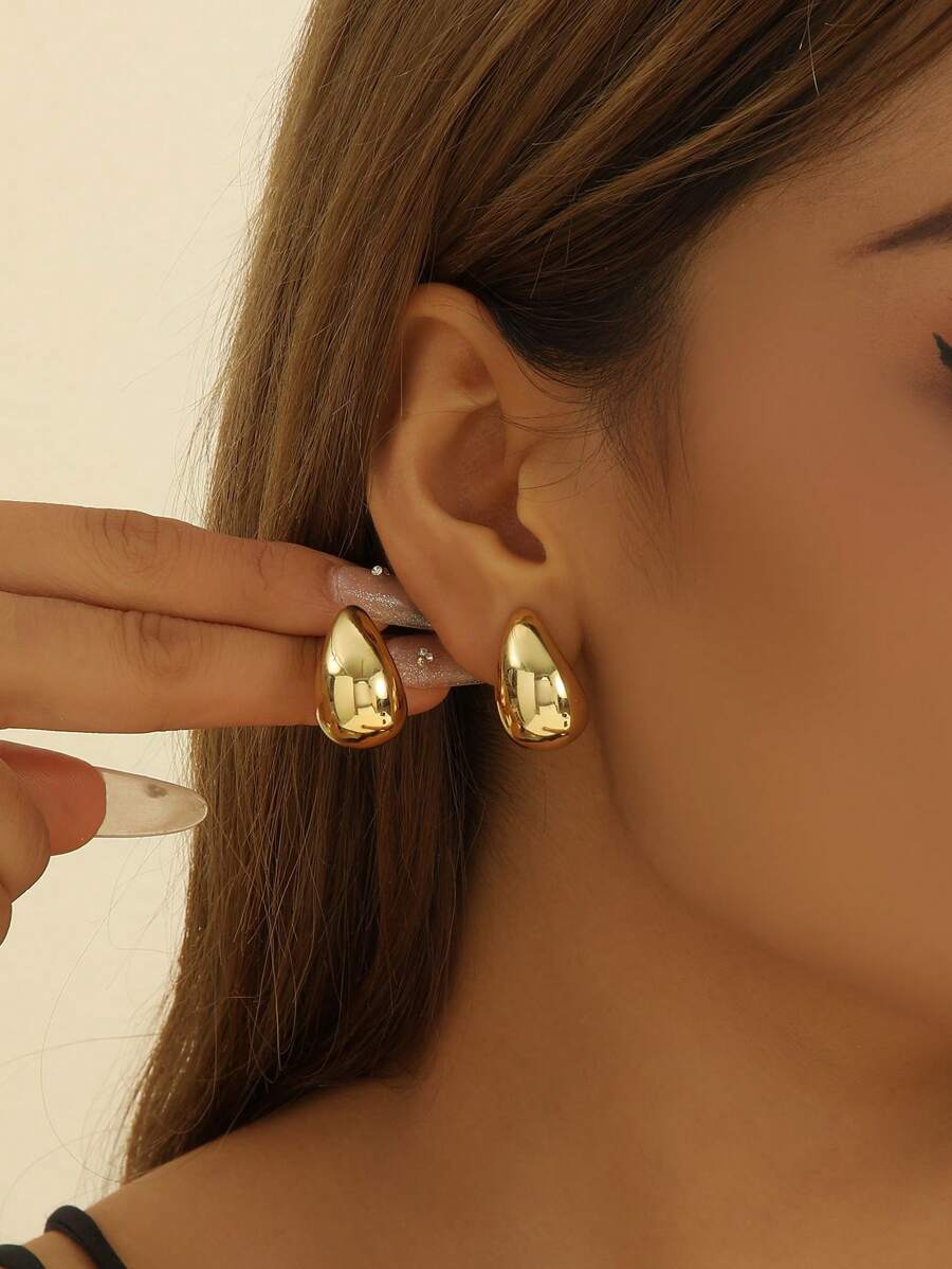 Goutte Gold-Tone Teardrop Stud Earrings – Sculpted Everyday Pair — Worn view