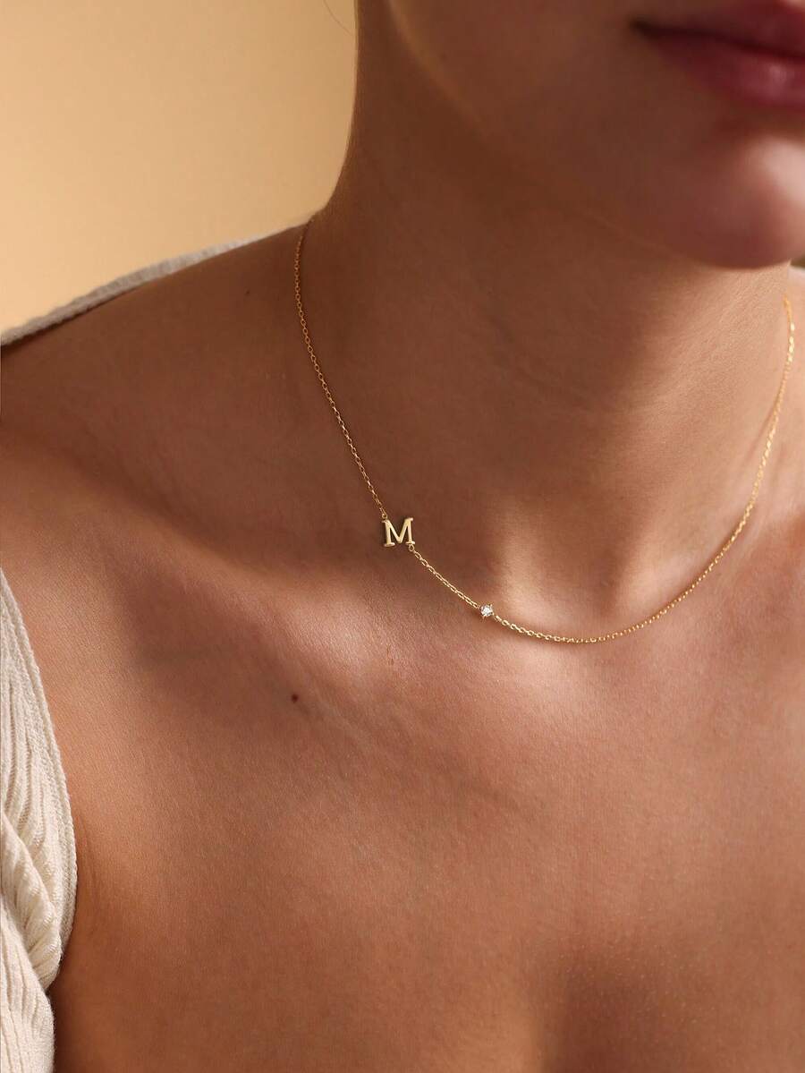 Leonie 14K Gold-Plated Initial Necklace – Sideways Letter & CZ — M initial worn view