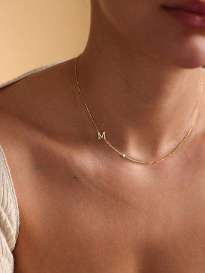 Leonie 14K Gold-Plated Initial Necklace – Sideways Letter & CZ — M initial worn view