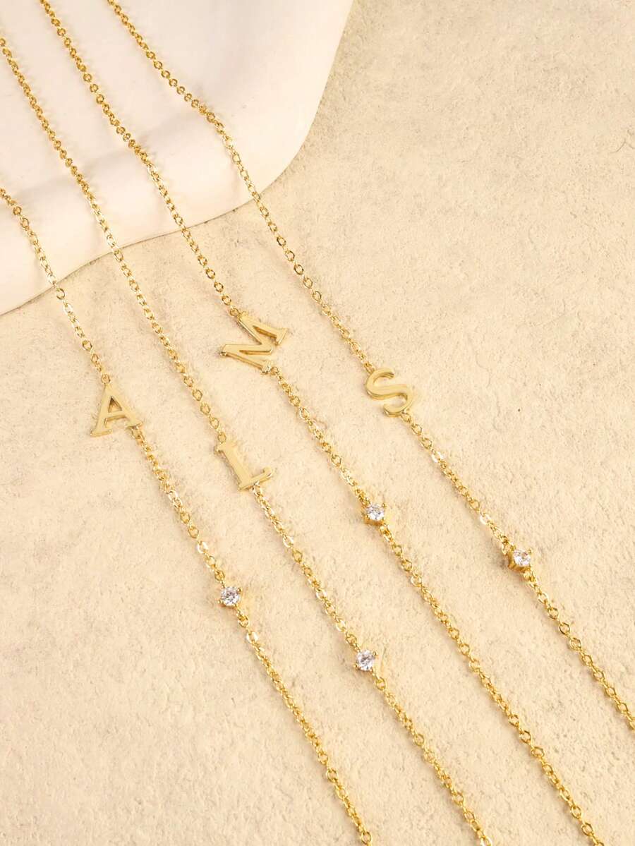 Leonie 14K Gold-Plated Initial Necklace – Sideways Letter & CZ — Alternate initial details; one necklace per selected initial