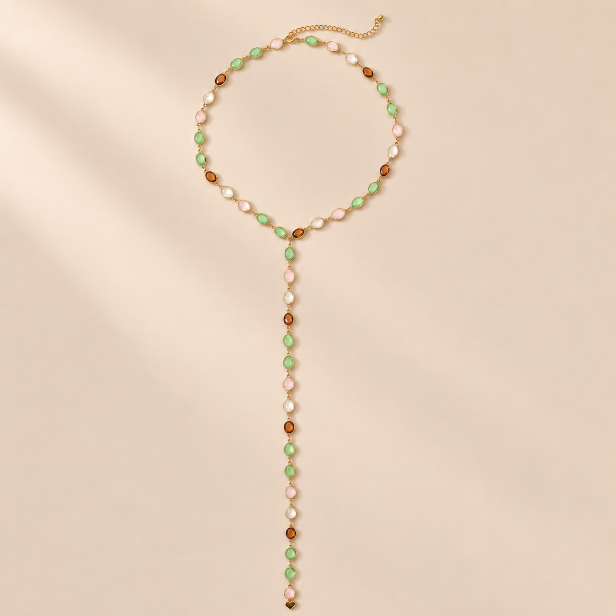 Liora 18K Gold-Plated Beaded Y Necklace — warm beige studio background