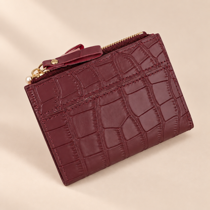 Ravelle Burgundy Croc-Effect Mini Wallet — warm beige studio background