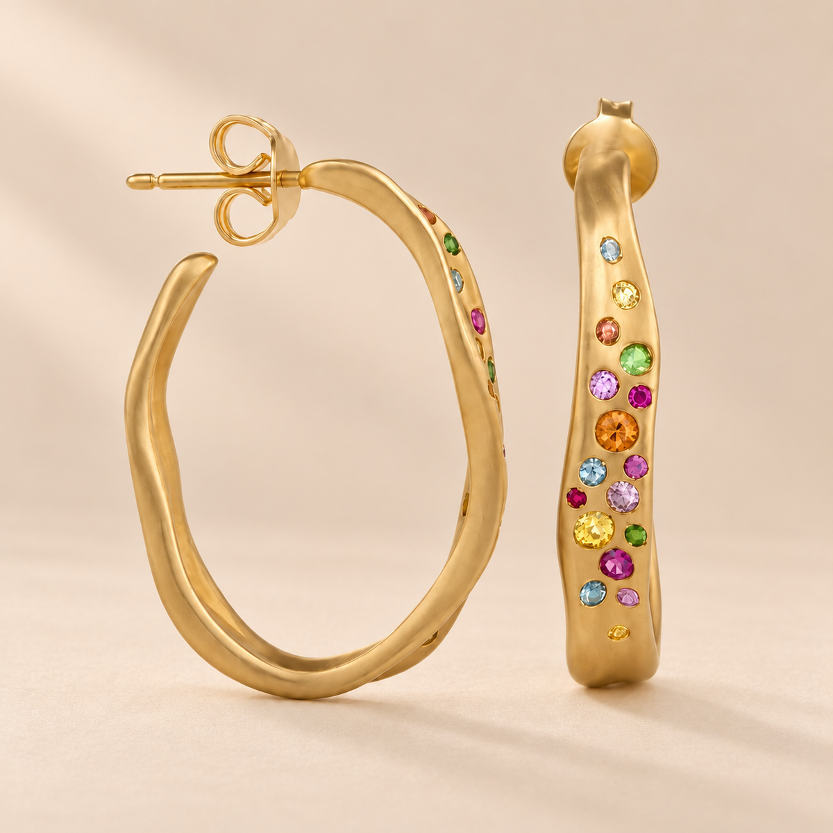 Arcelle 14K Gold-Plated Hoop Earrings — warm beige studio background