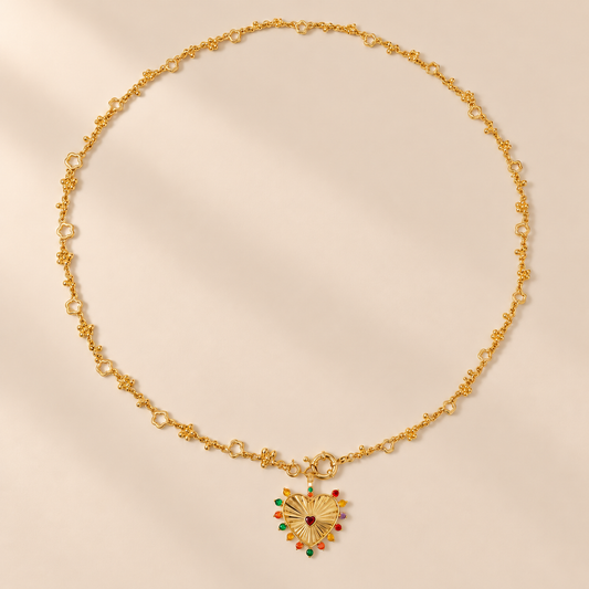 Amorette 18K Gold-Plated Heart Necklace — warm beige studio background