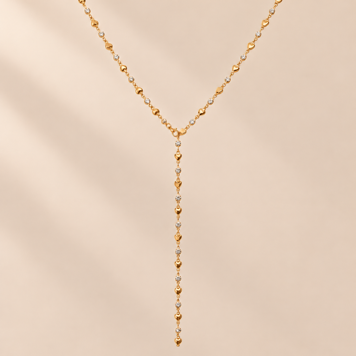 Amourline 14K Gold-Plated Y Necklace — warm beige studio background