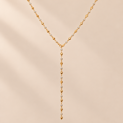 Amourline 14K Gold-Plated Y Necklace — warm beige studio background